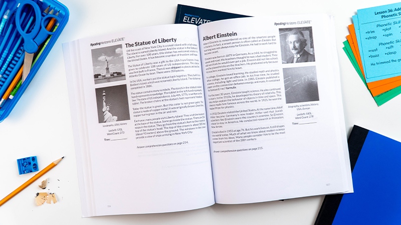 The Reading Horizons Elevate Student Book laying open to show two example passages.