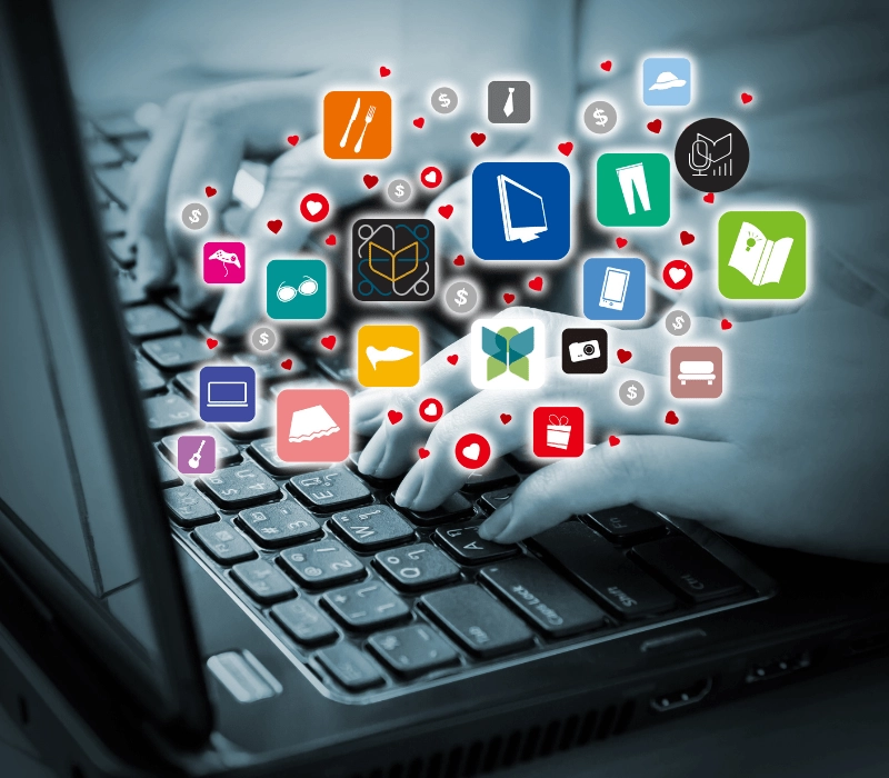 laptop with hands and free resources icons