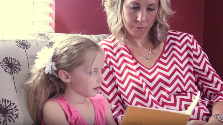 mom and daughter reading a book