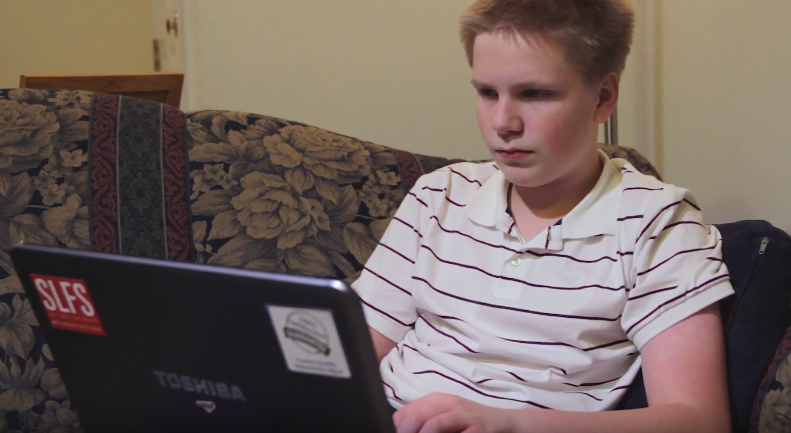 Older boy working on Reading Horizons At-Home on Laptop